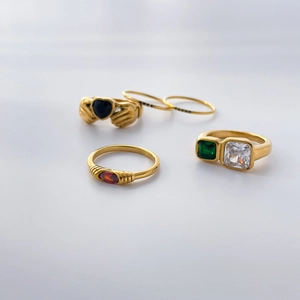 Golden titanium steel rings set with black heart zircon and emerald cut stones
