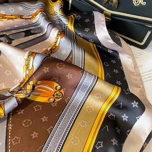 Elegant silk scarf for women featuring gold chain patterns and vintage belt print motifs