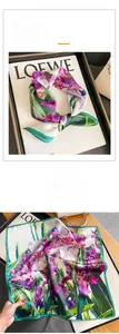 Detailed view of vintage iris floral silk scarf with vibrant purple and green oil painting patterns