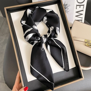 Elegant 70cm silk scarf with white fashion prints on black, displayed in a gift box