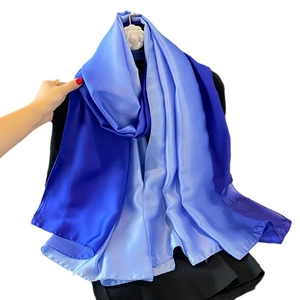 Blue gradient satin silk scarf for women shown on a hanger with soft texture detail