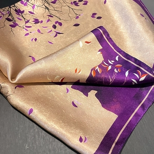 Elegant champagne silk scarf featuring purple leaf patterns with a luxurious satin finish