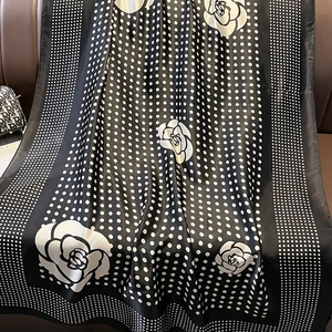 Elegant oversized beach towel with classic polka dots and white rose floral pattern