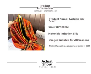 Détail d'un foulard en soie orange 90x180cm avec imprimés floraux dorés et texture fine