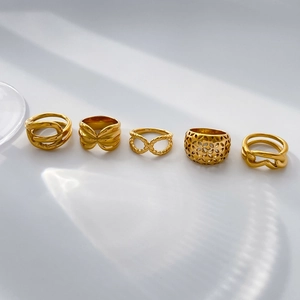 5-piece set of 18K gold plated titanium steel rings with hollow twist rope patterns