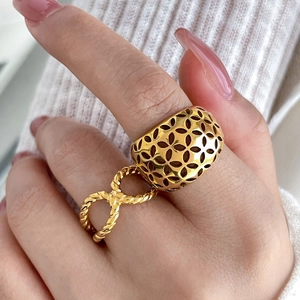 18K gold plated wide titanium ring with hollow flower patterns and rope twist band