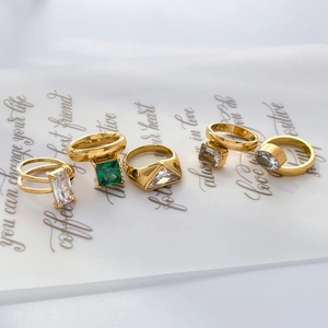 5-piece 18K gold plated titanium rings set with emerald and clear zircon stones