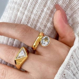 18K gold plated geometric rings with triangle and oval cubic zirconia on hand