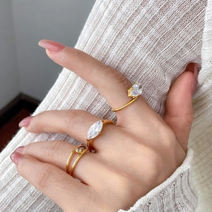 Three-piece gold titanium steel ring set with marquise-cut and round cubic zirconia