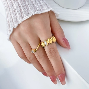Detail of 18K gold-plated titanium ring featuring marquise zircon and a teardrop design