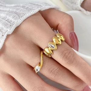 Gold-plated teardrop marquise cubic zirconia ring on finger with elegant aesthetic
