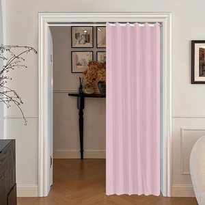 Pink pleated folding door curtain with white rings installed as a room divider