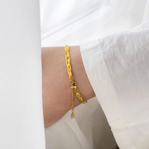 Detail of gold-plated multi-strand woven chain bracelet with lobster clasp and extender