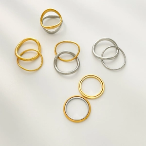Minimalist curved wave stackable titanium steel rings in gold and silver polished finish