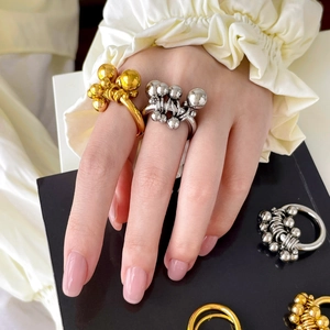 Minimalist double-layer wavy titanium steel ring with mixed metal beads in 18K gold finish