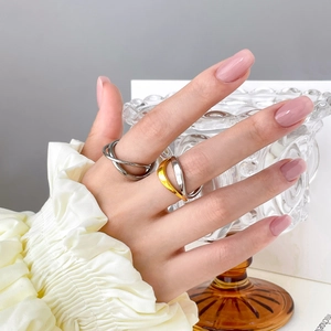 Minimalist double layer wavy 18K gold plated titanium steel rings on female hand