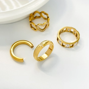 Minimalist gold-plated stainless steel ring set with hollow hearts and zircon stones
