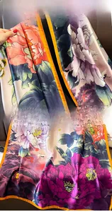 Detail of silk-like scarf featuring floral peony print and high-quality stitched edges