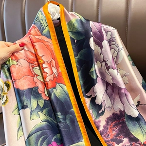 Elegant silk scarf with peony floral print and orange borders for sun protection