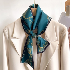 Elegant dark green silk-like skinny scarf with golden ginkgo leaf pattern for women