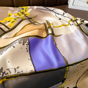 Detail of elegant silk scarf texture with modern geometric patterns and satin sheen