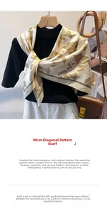 Detail of 90cm twill silk scarf showing beige and gold geometric patterns on a mannequin