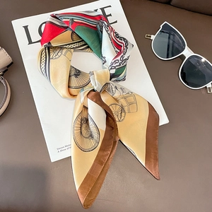 Silk-like square scarf with retro horse carriage pattern on a fashion magazine