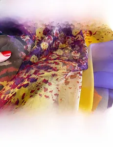 Macro detail of breathable silk scarf showing smooth texture and colorful abstract patterns