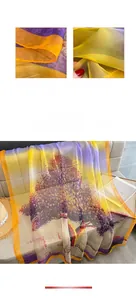 Detail of gradient silk scarf featuring silhouette prints and fine digital printing craftsmanship