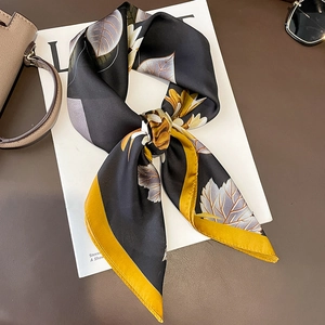 Floral silk-like scarf with yellow accents and black botanical print for elegant styling