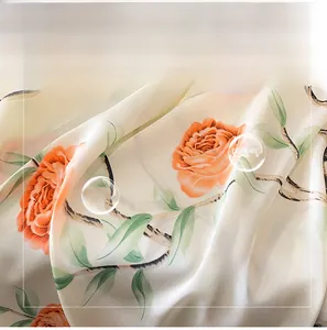 Detailed macro view of soft silk-like fabric with floral print and smooth texture