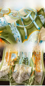 Detail of premium silk scarf featuring classical equestrian patterns and refined hem edges