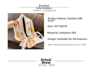 Detail of silk-like sun protection shawl with vibrant yellow floral patterns on dark background