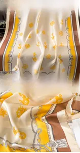 Detail showing nautical anchor print on silky beach shawl with refined edge stitching
