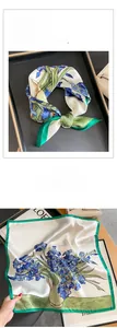 Détail d'un foulard carré en soie avec imprimé iris bleu et bordure vert vif