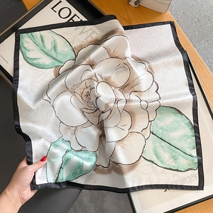 Elegant silk square scarf featuring a white camellia print and soft satin finish