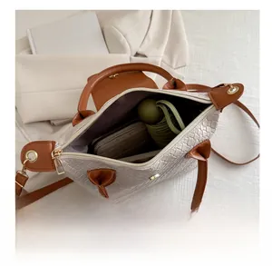 Internal view of the woven tote bag showing space for an umbrella and a long wallet