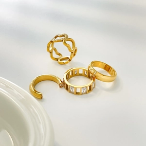 Set of four gold-plated stainless steel rings with heart shapes and zircon stones