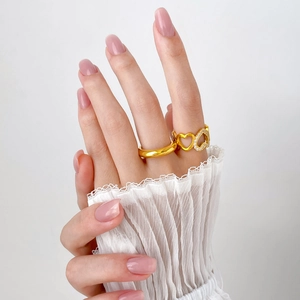 Gold-plated ring set featuring a hollow heart design with micro-inlaid zircon accents