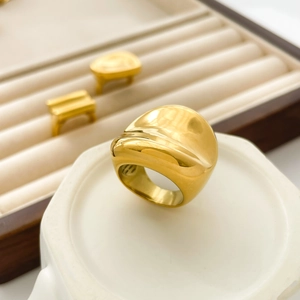 Detailed view of the irregular concave gold ring with a polished 18K mirror finish