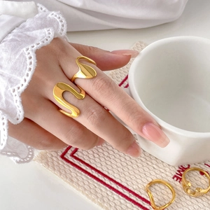 Minimalist 18K gold plated stainless steel wavy rings stacked on hand for women