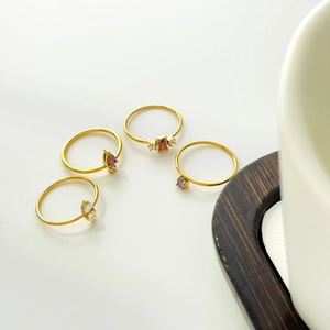Elegant 18K gold-plated titanium rings set with red, purple, and white teardrop zircons