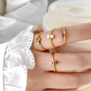 Set of four 18K gold plated stackable rings with colorful zircon drops and squares