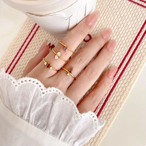 Set of 18K gold-plated titanium steel rings with colorful zircon gems worn on fingers