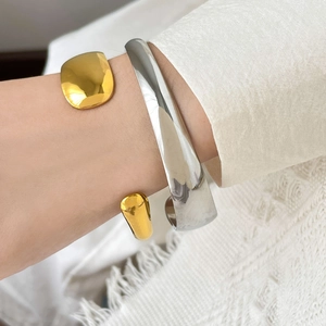 Two-tone curved snake-style open cuff bracelets in gold and silver stainless steel