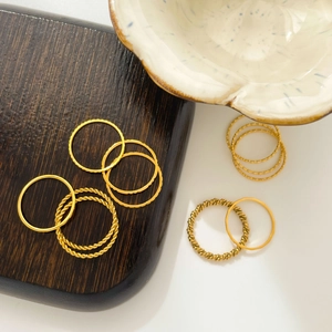 Stackable 18K gold plated titanium steel rings with twisted and hammered textures