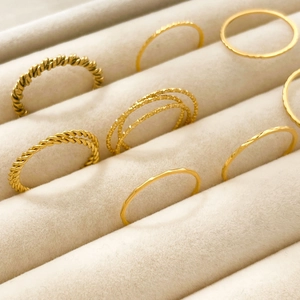 Stackable 18K gold plated titanium steel rings with twisted and hammered textures