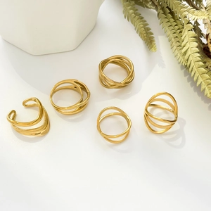 Minimalist 18K gold plated geometric layered line rings and ear clips set on white background