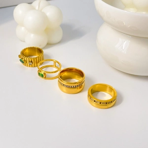 Four-piece 18K gold-plated titanium steel ring set with green zircon and gear eye designs