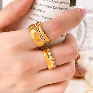 Close-up of dual-layer 18K gold plated titanium ring set with sparkling zircons